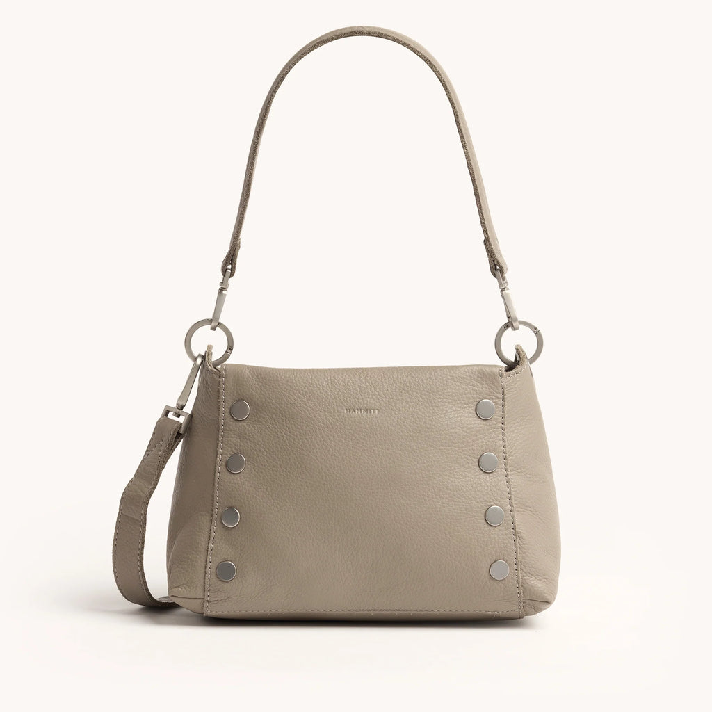 Beige handbag with silver accents on a white background